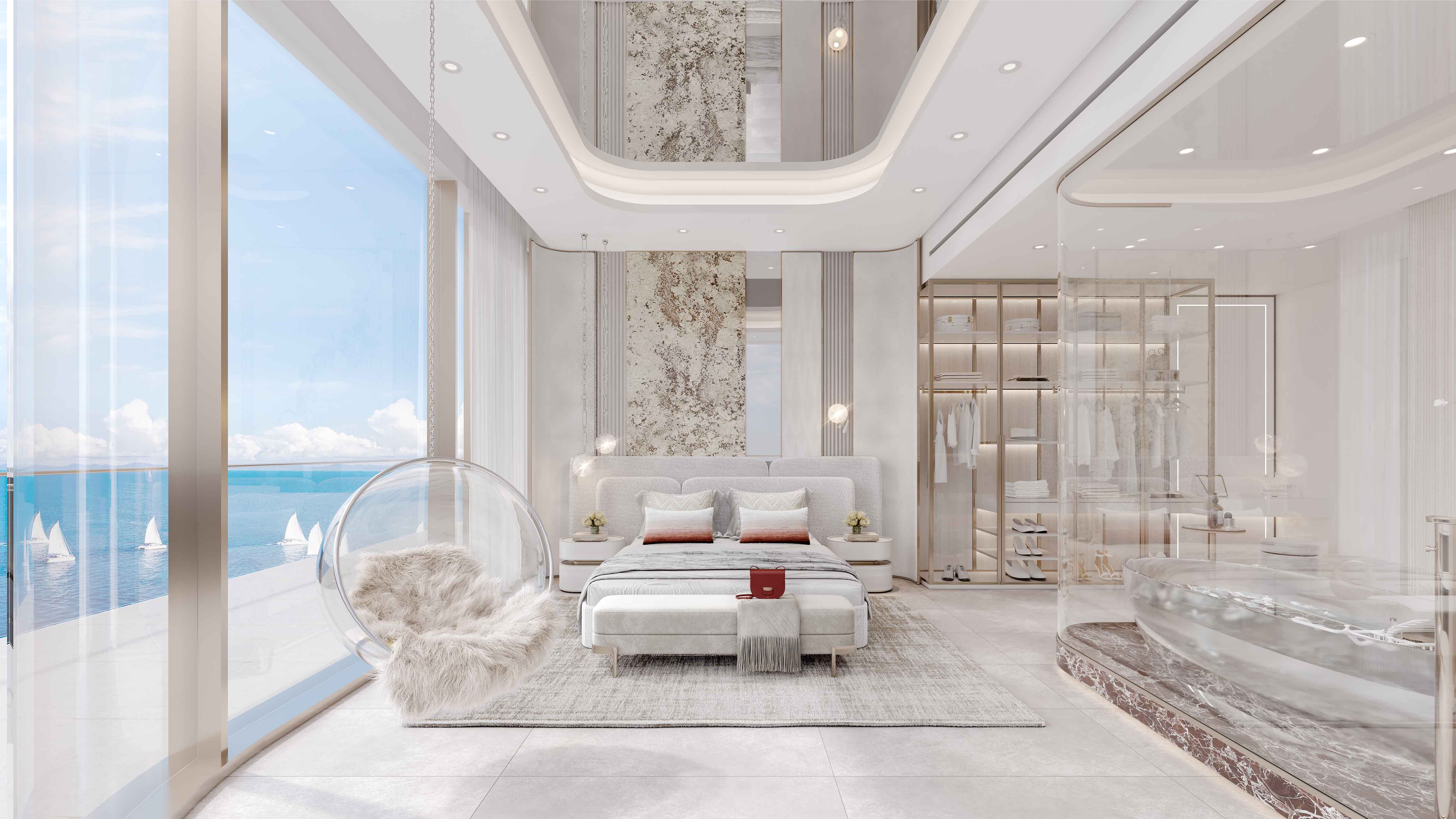 Cotier House 2 By Imtiaz A modern bedroom with ocean views, featuring a plush bed, elegant decor, a bubble chair, and a stylish bathroom area.